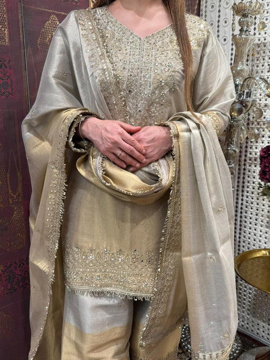 Presenting a timeless three-piece ensemble that defines grace