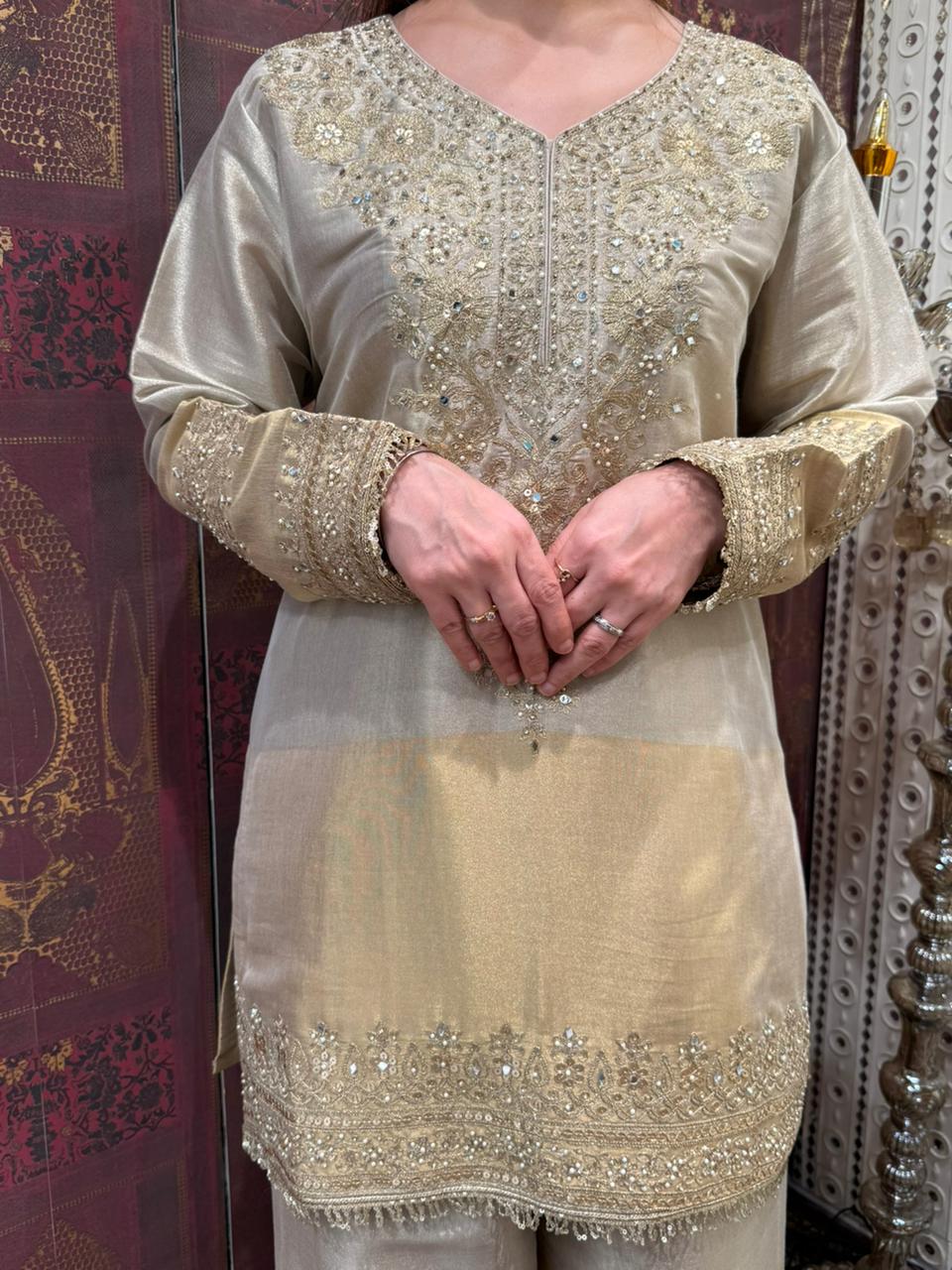 Presenting a timeless three-piece ensemble that defines grace