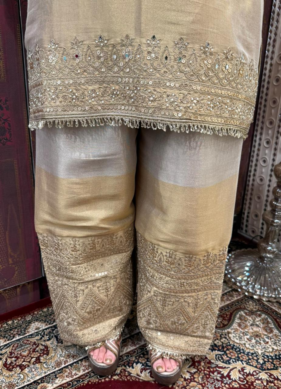 Presenting a timeless three-piece ensemble that defines grace