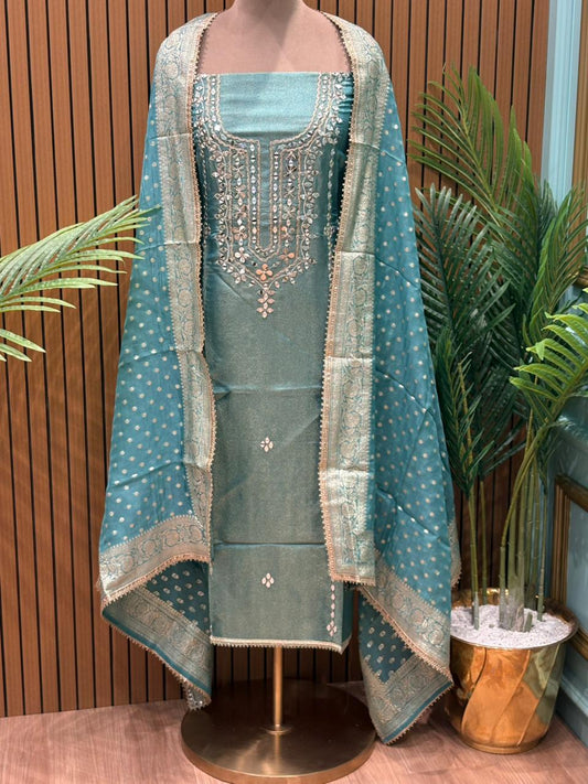 Regal unstitched suit set is crafted in elite shimmery organza fabric