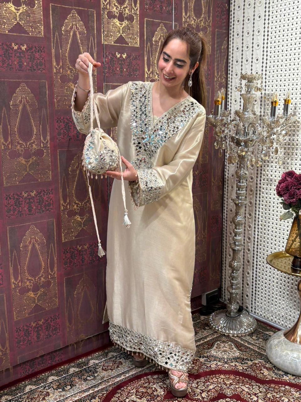 Elegant long kurta set is crafted in luxurious tissue silk fabric