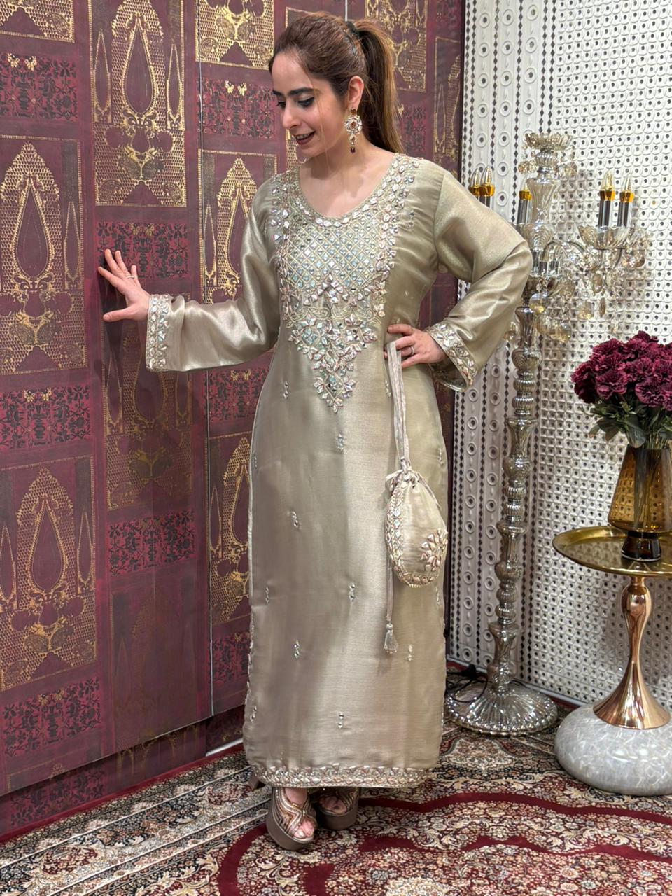 Elegant Pheran-style kurta set is made in luxurious tissue silk