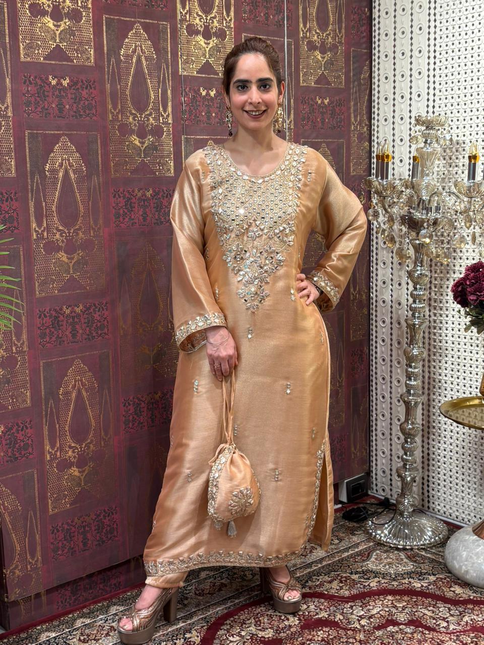 Elegant Pheran-style kurta set is made in luxurious tissue silk