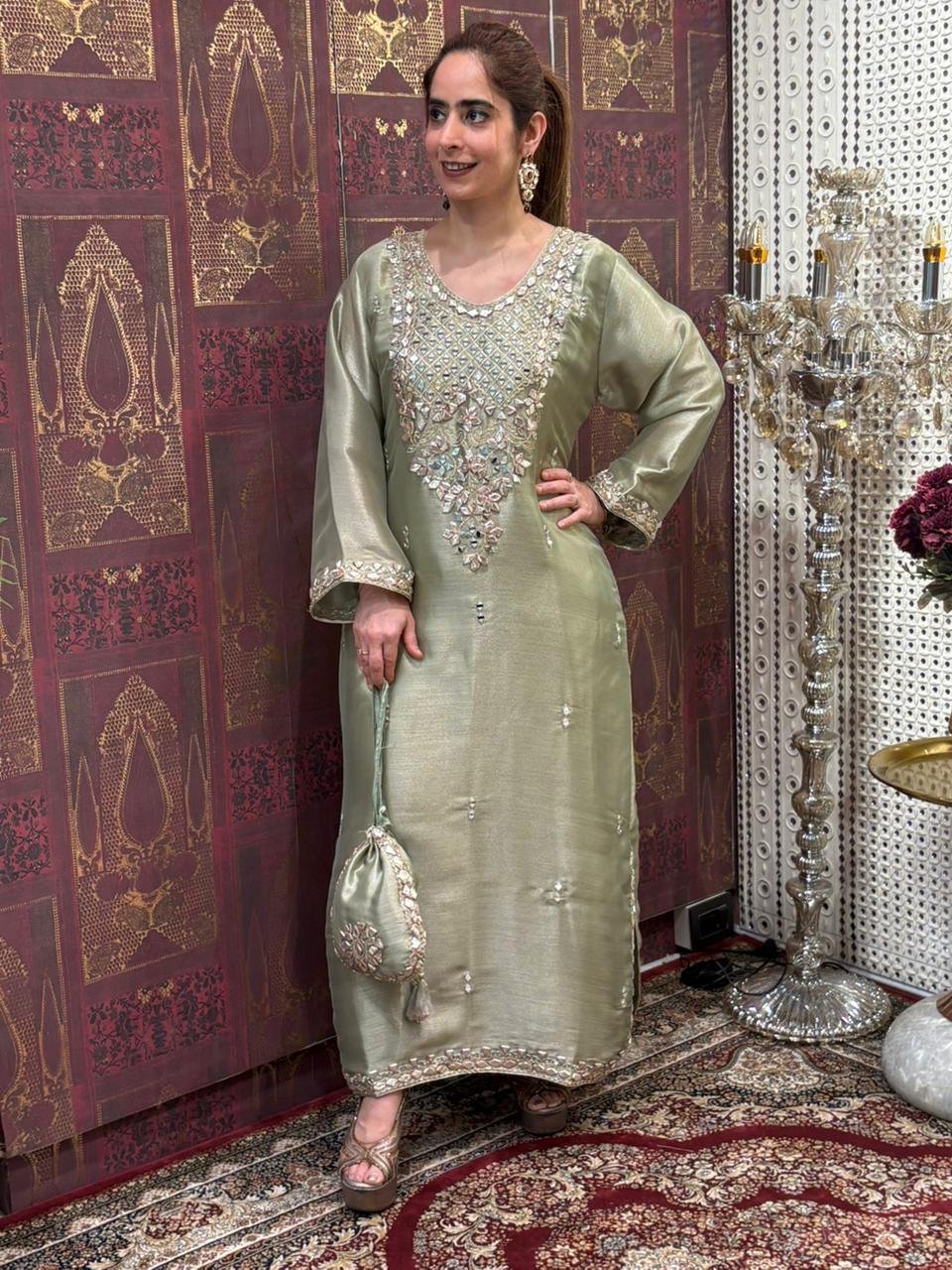 Elegant Pheran-style kurta set is made in luxurious tissue silk