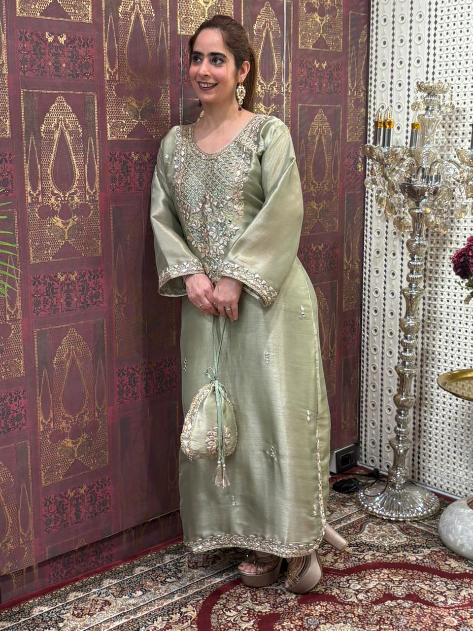 Elegant Pheran-style kurta set is made in luxurious tissue silk