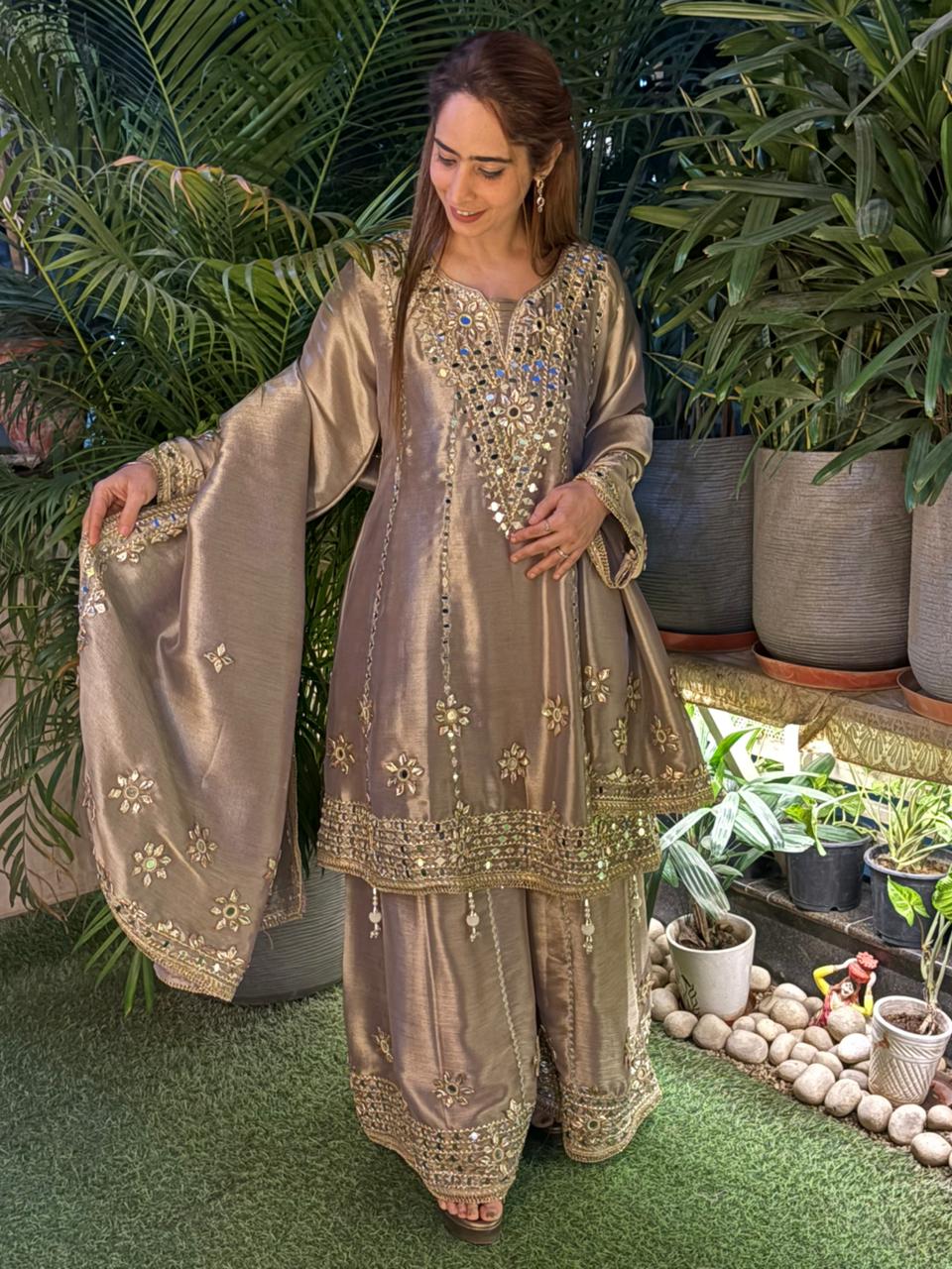 Exquisite Anarkali set is crafted in luxurious tissue silk fabric