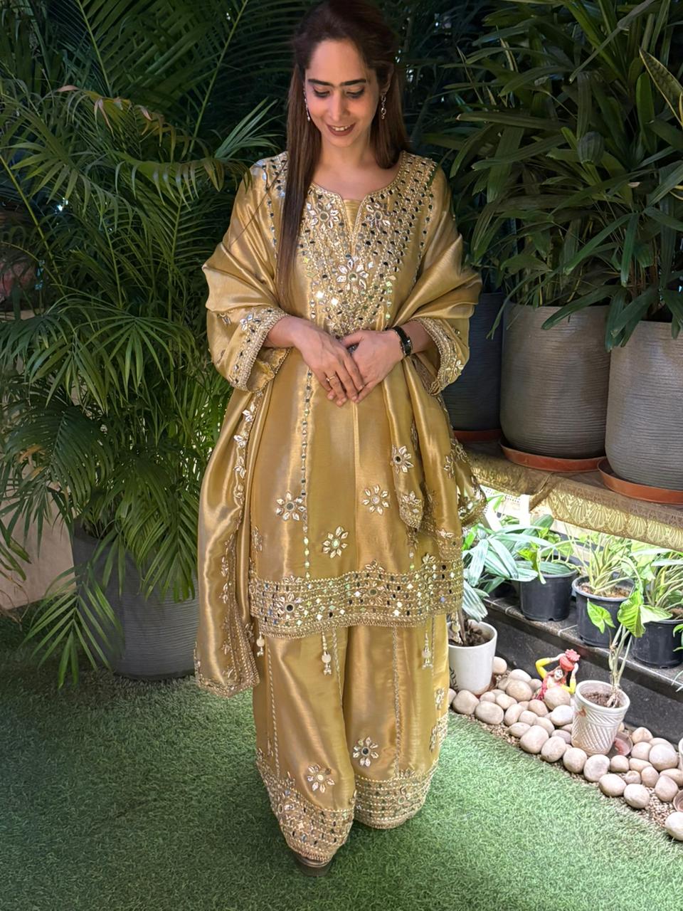 Exquisite Anarkali set is crafted in luxurious tissue silk fabric