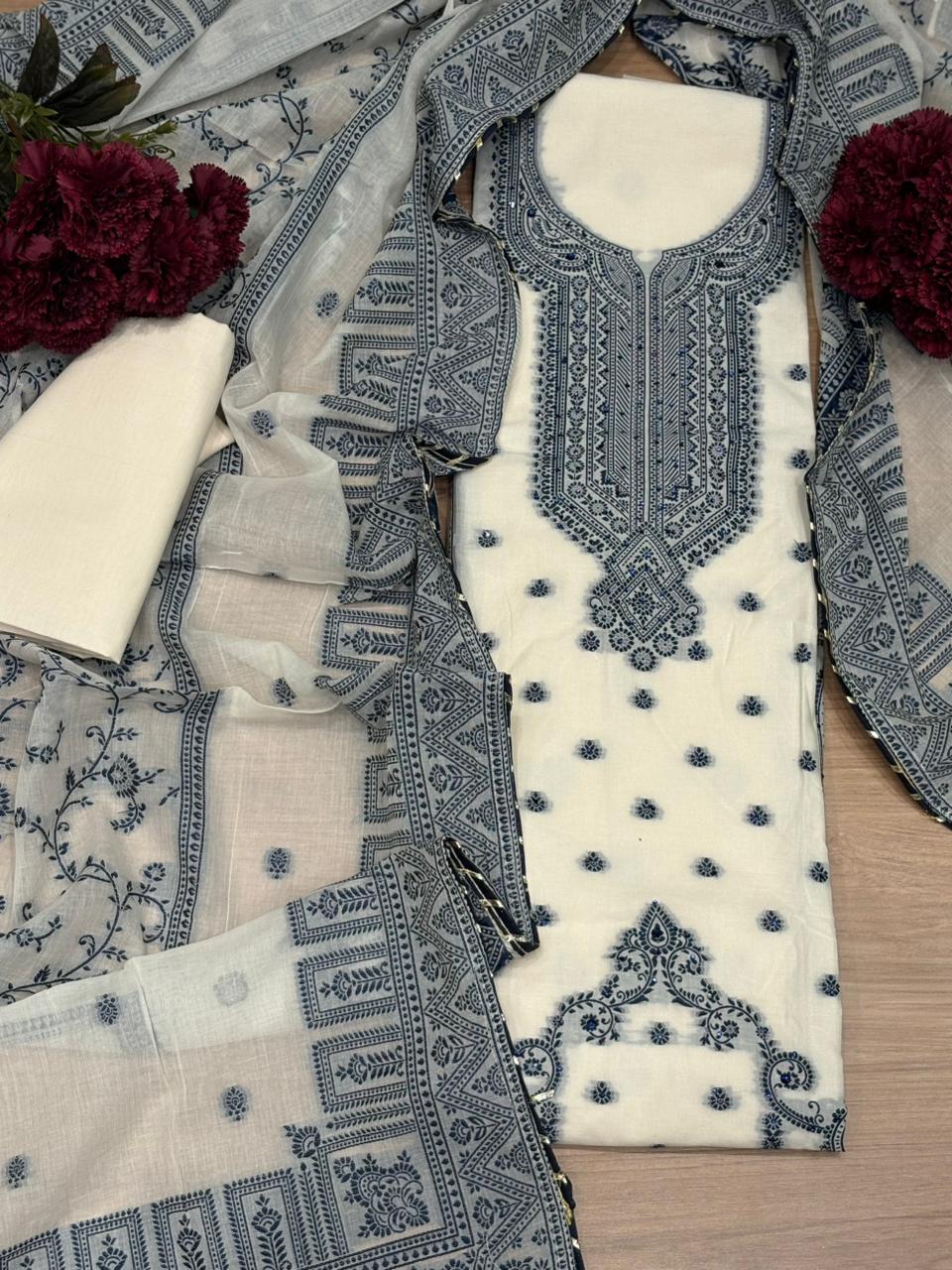 Elegant unstitched suit set is crafted in premium cotton fabric