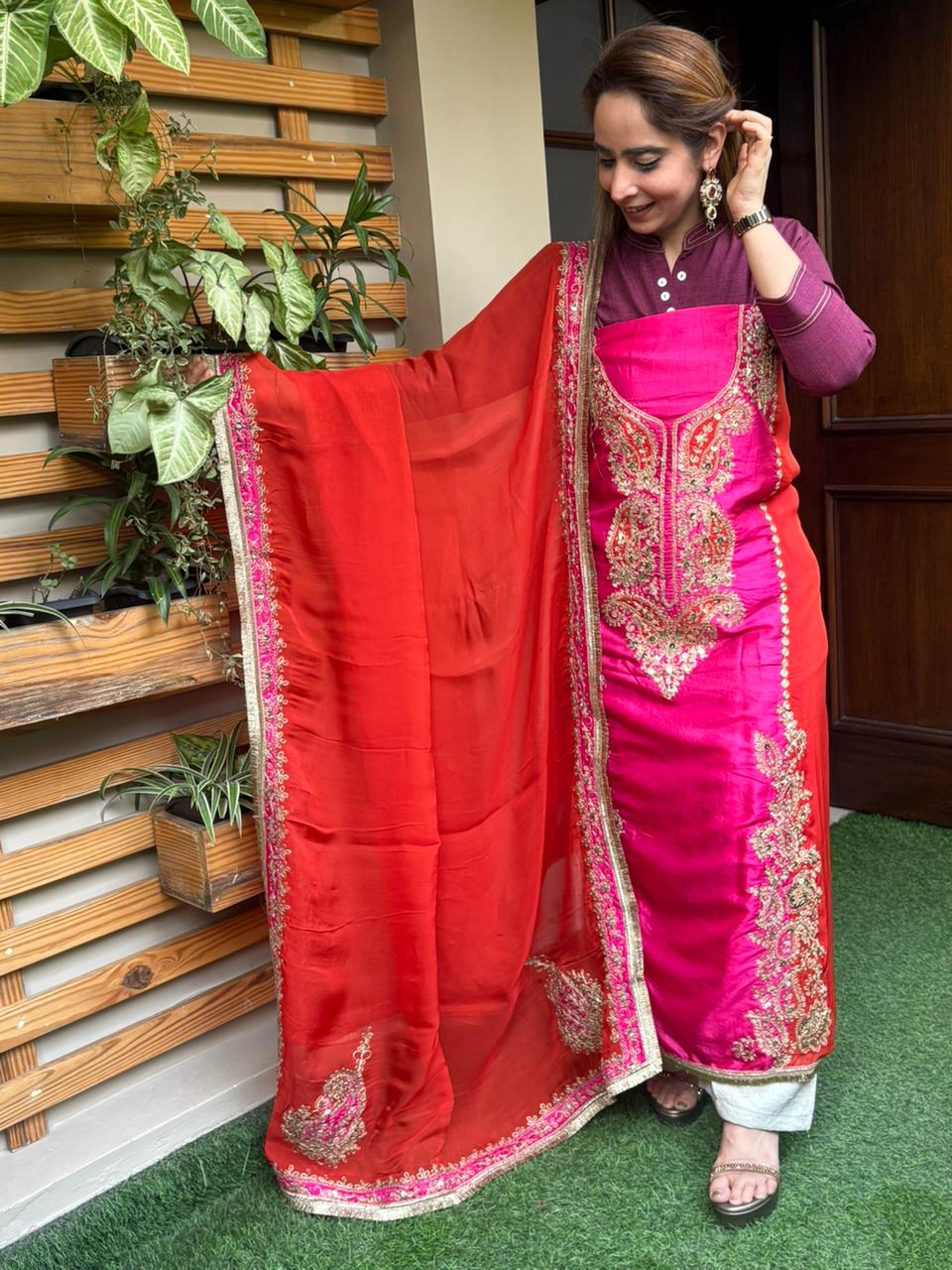 Elegant unstitched suit is crafted in rich silk fabric