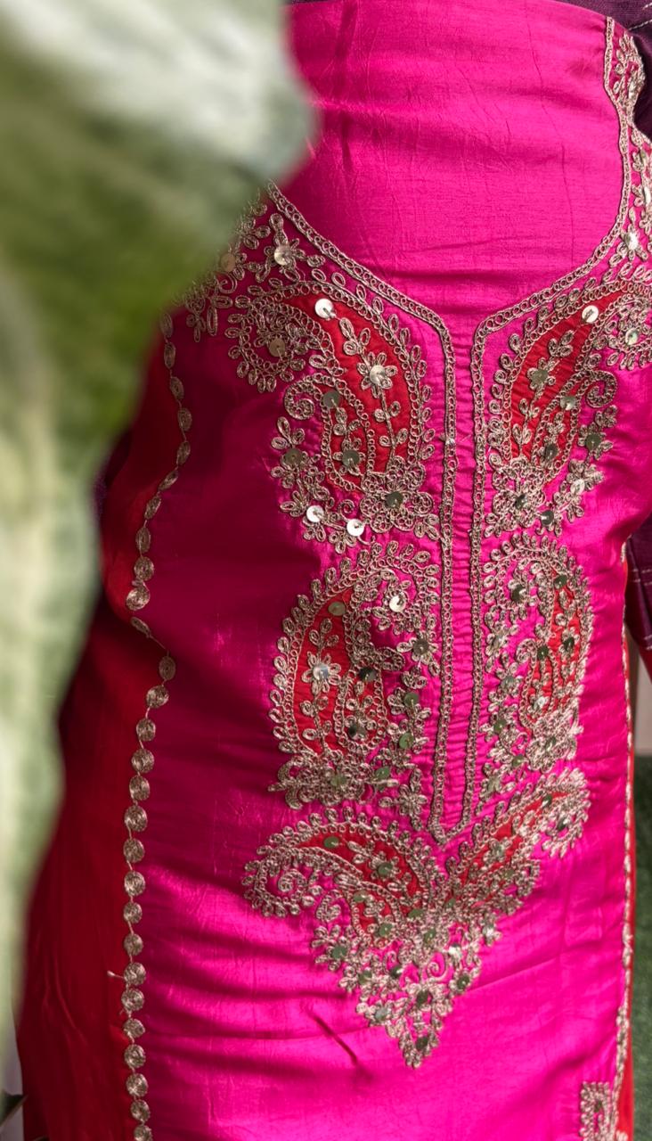 Elegant unstitched suit is crafted in rich silk fabric