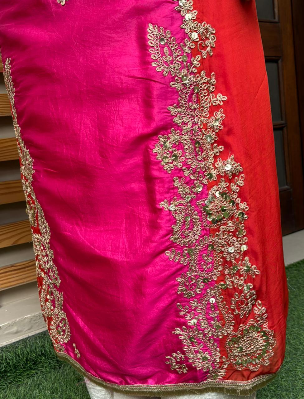 Elegant unstitched suit is crafted in rich silk fabric
