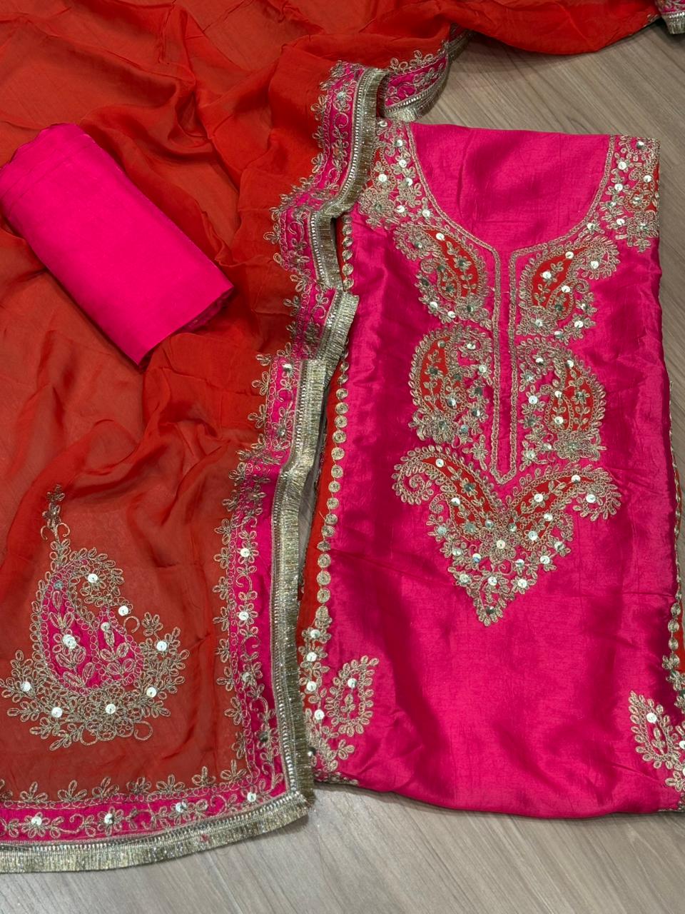 Elegant unstitched suit is crafted in rich silk fabric