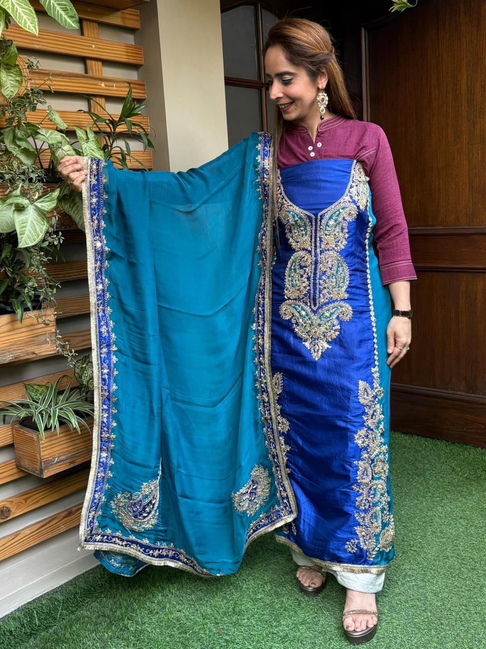 Elegant unstitched suit is crafted in rich silk fabric