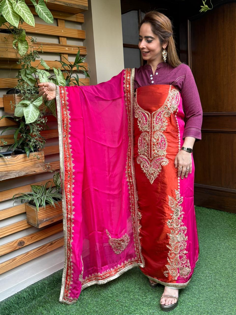 Elegant unstitched suit is crafted in rich silk fabric