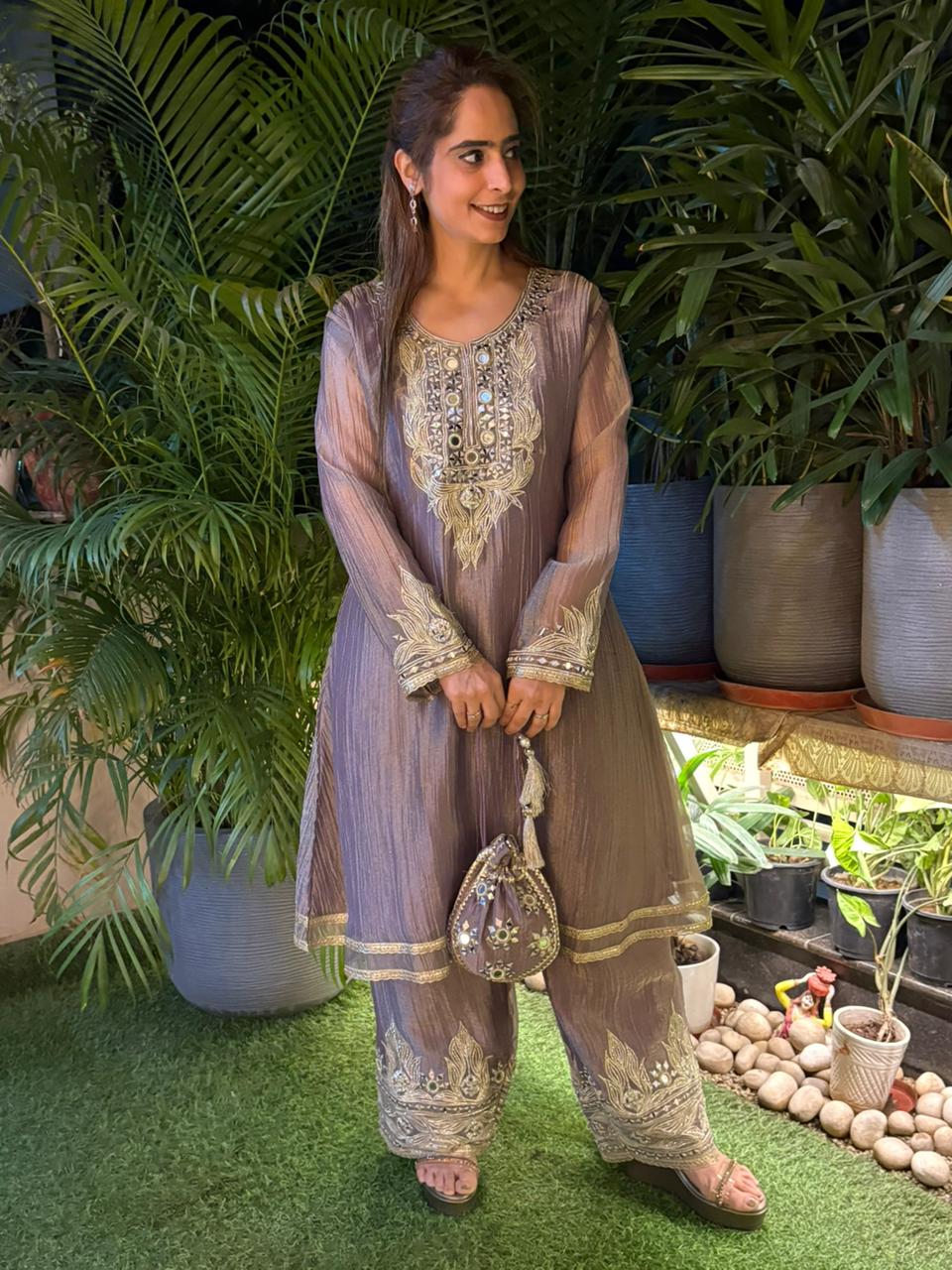 Graceful Anarkali set is crafted in luxurious tissue shimmer fabric