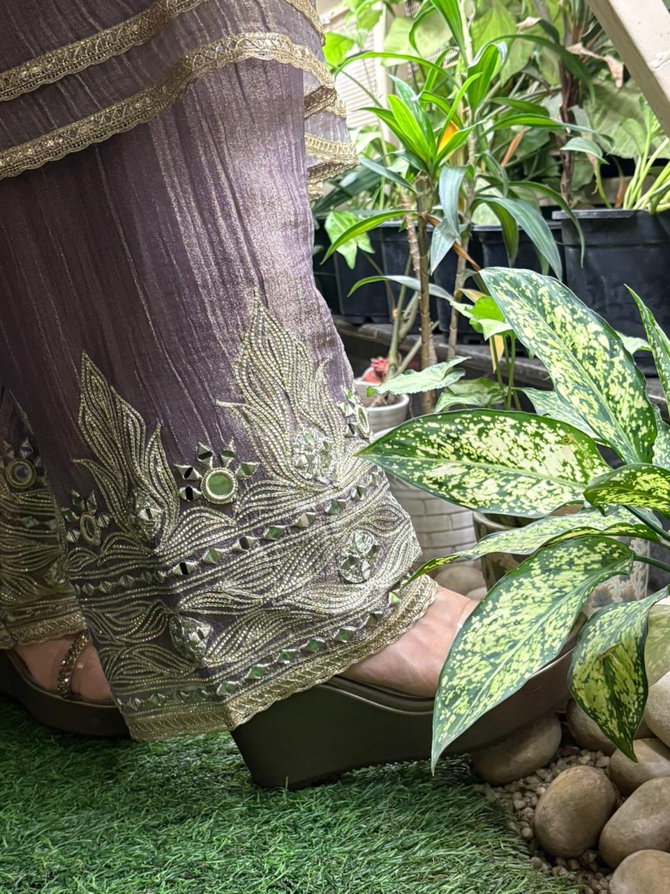 Graceful Anarkali set is crafted in luxurious tissue shimmer fabric