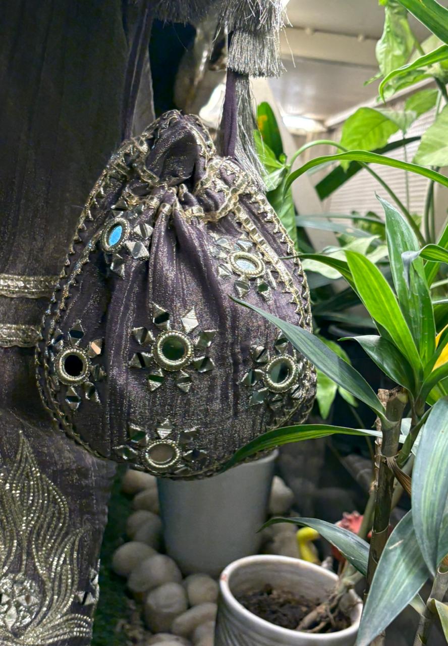 Graceful Anarkali set is crafted in luxurious tissue shimmer fabric