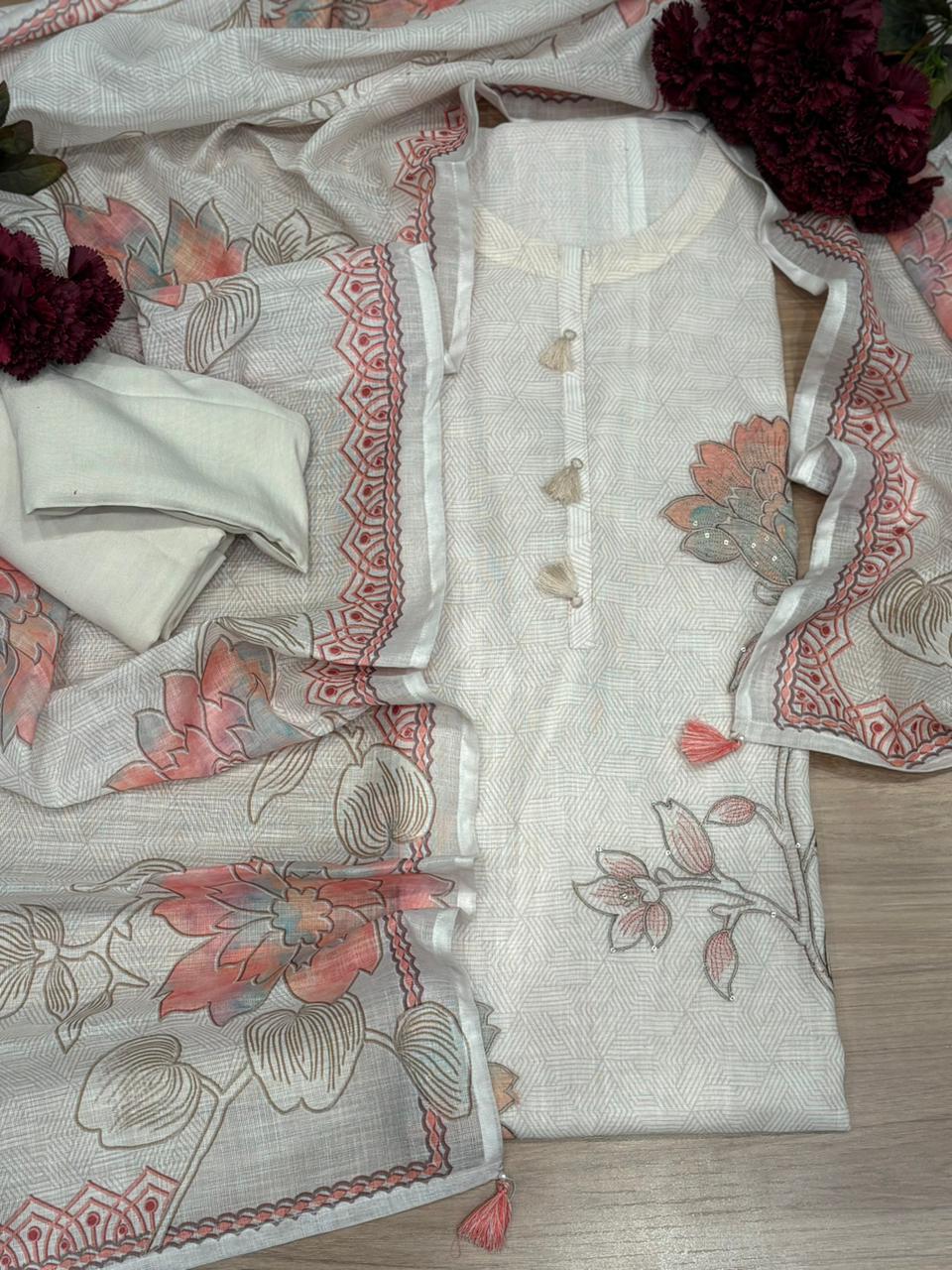 Elegant unstitched suit is crafted in breathable linen cotton fabric