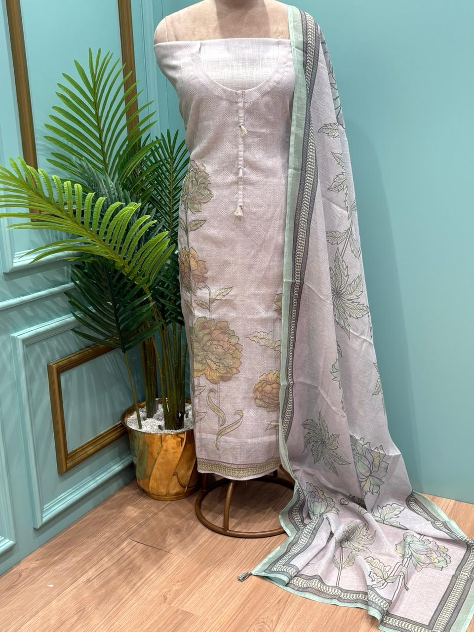 Elegant unstitched suit is crafted in breathable linen cotton fabric