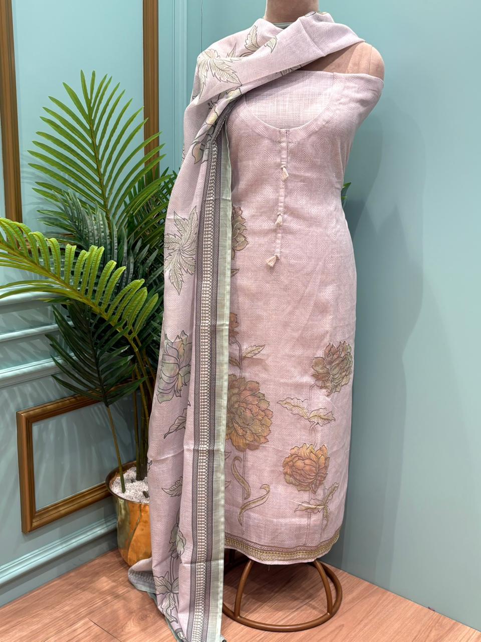 Elegant unstitched suit is crafted in breathable linen cotton fabric