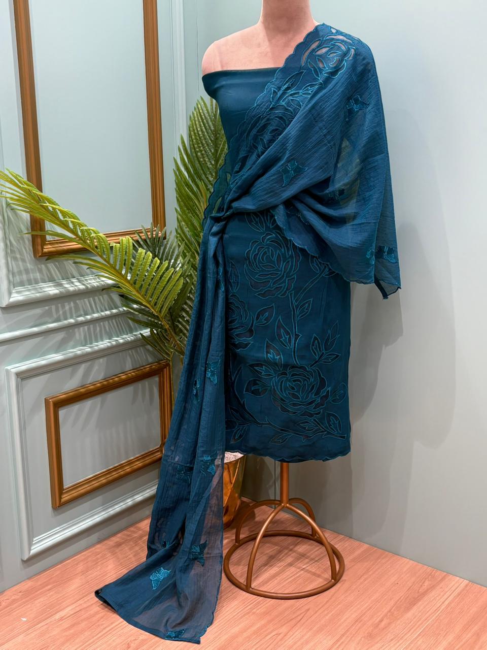 Elegant unstitched suit is crafted in premium muslin cotton