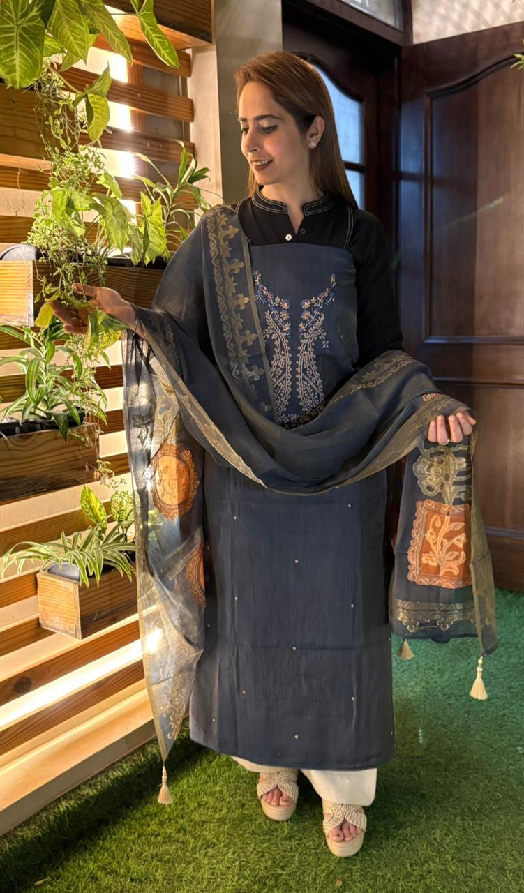 Experience timeless elegance with this unstitched suit