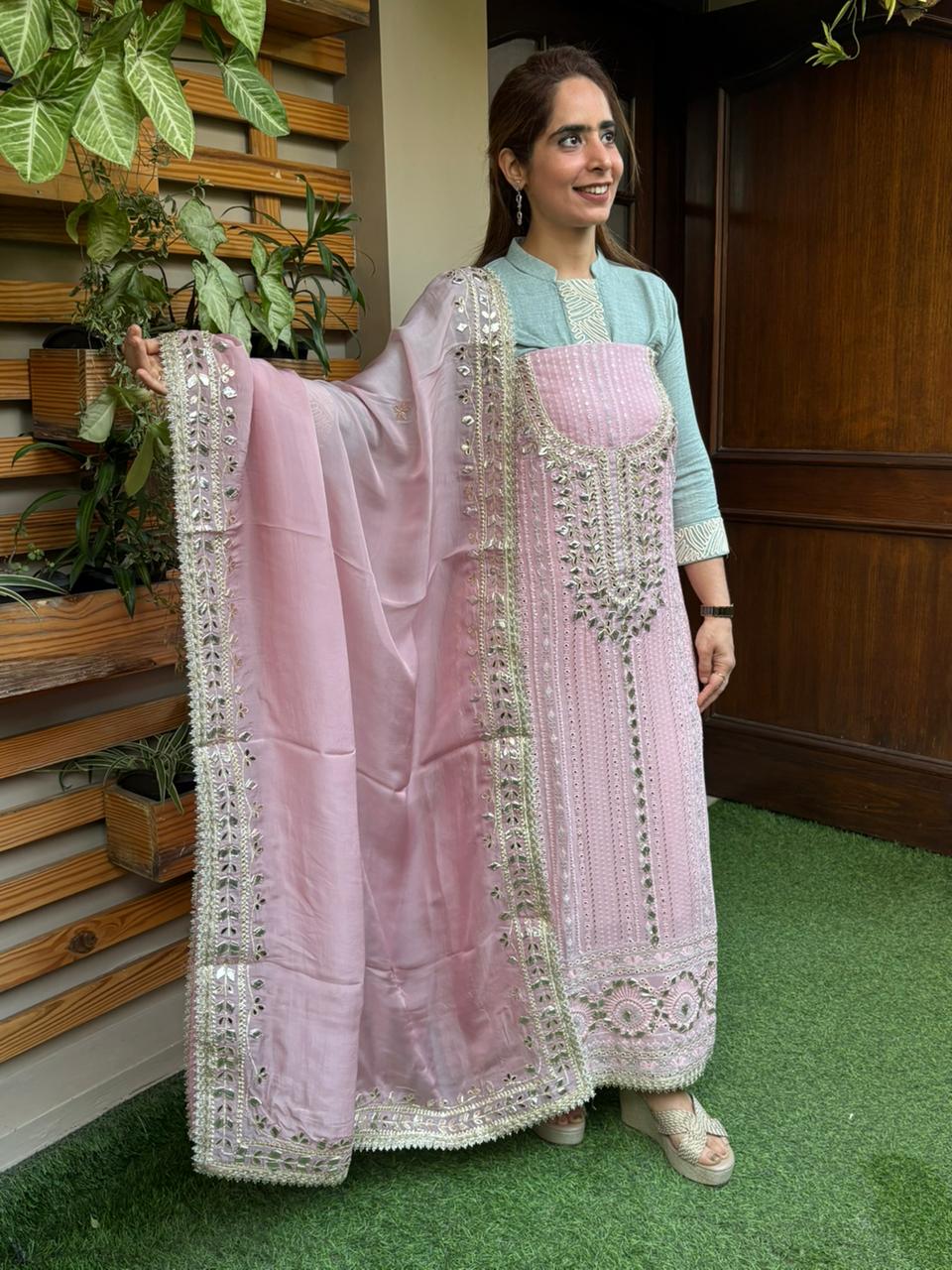 Elevate your ethnic wardrobe with this graceful unstitched suit