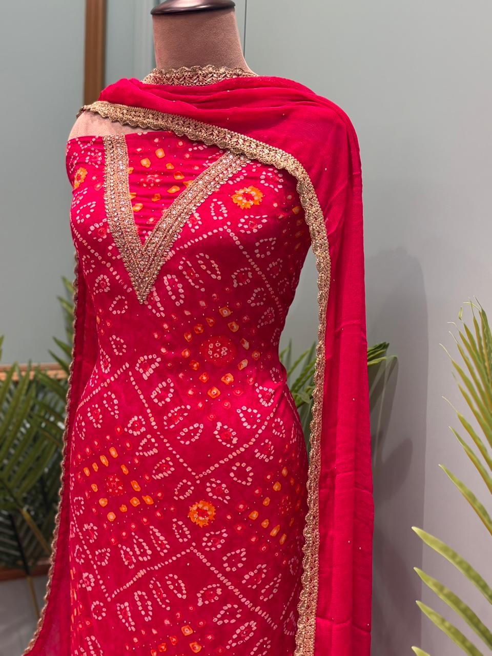 Elegant unstitched suit set is crafted in premium Chinon fabric