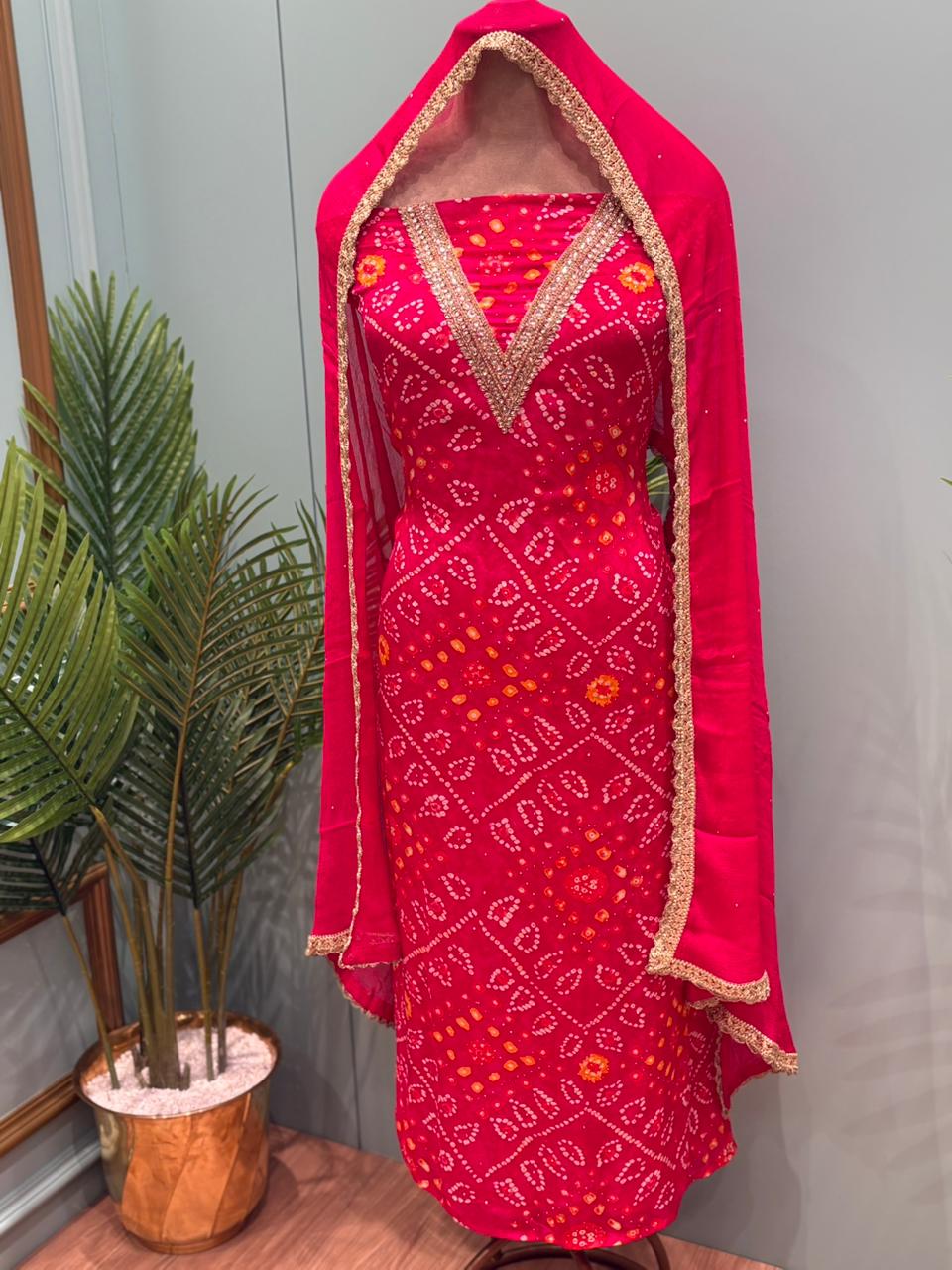 Elegant unstitched suit set is crafted in premium Chinon fabric