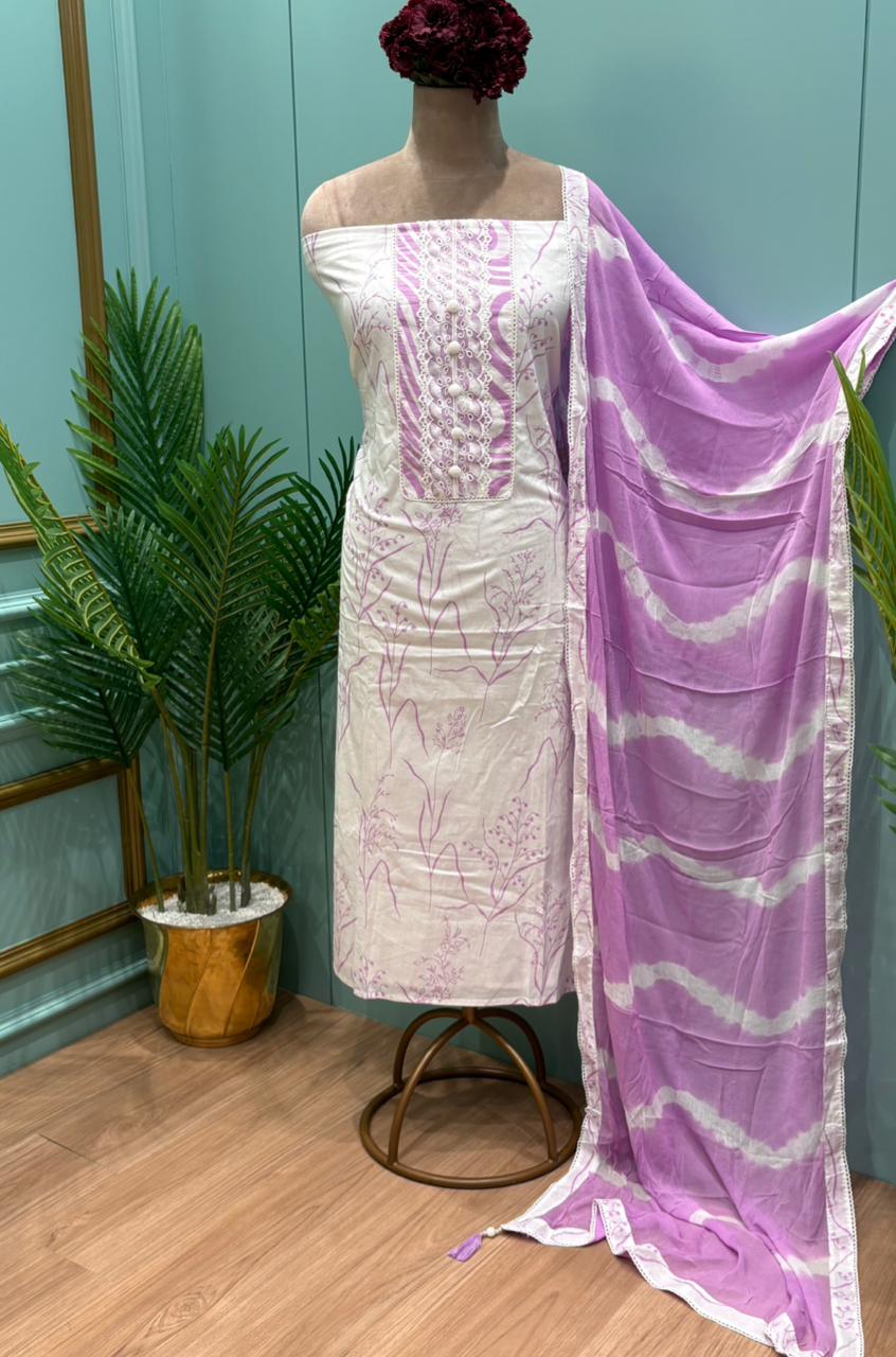 Elegant unstitched suit set is crafted from soft and breathable cotton fabric