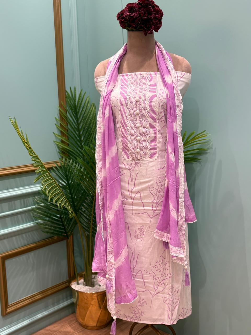 Elegant unstitched suit set is crafted from soft and breathable cotton fabric