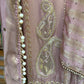 Unstitched suit crafted in rich tissue shimmer fabric