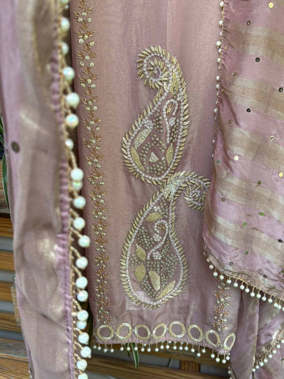 Unstitched suit crafted in rich tissue shimmer fabric
