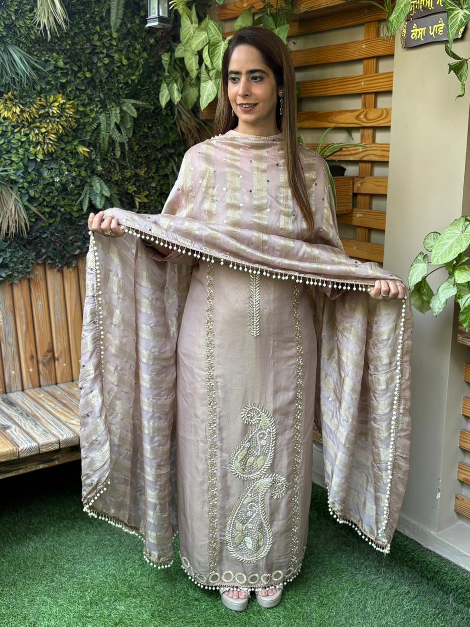 Unstitched suit crafted in rich tissue shimmer fabric