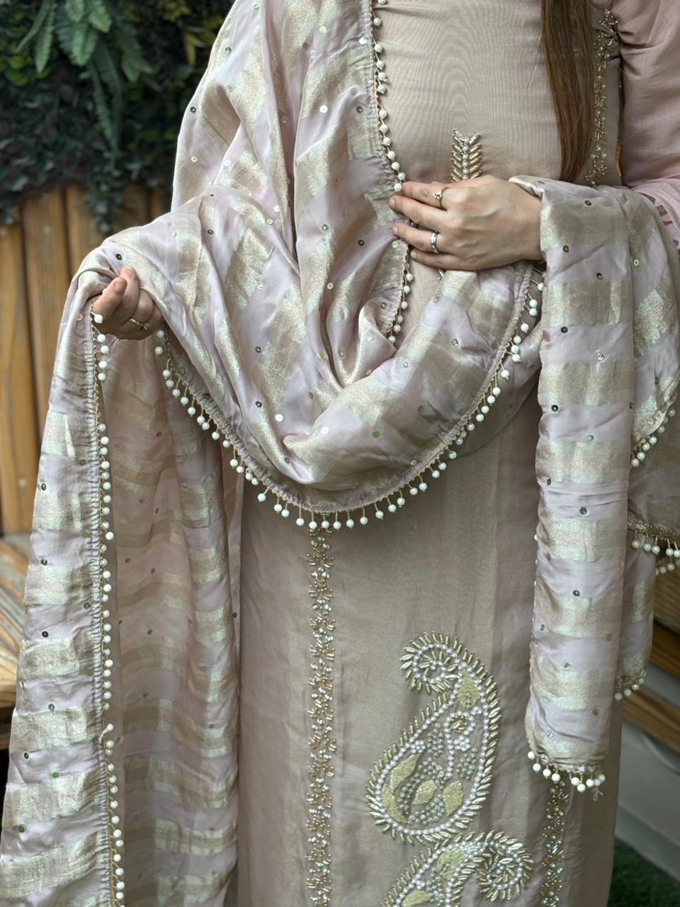 Unstitched suit crafted in rich tissue shimmer fabric