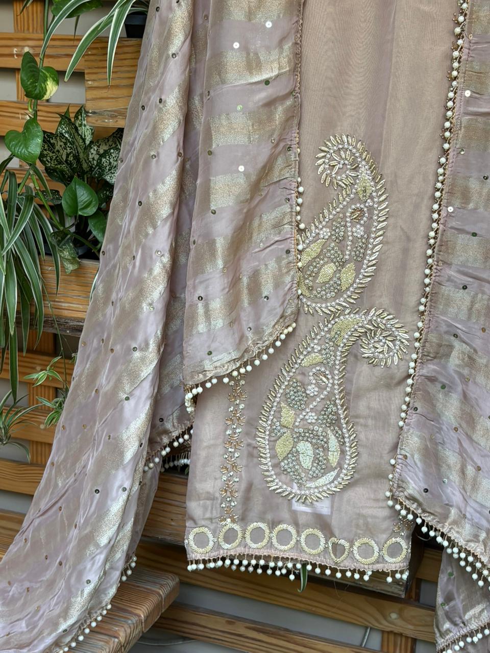 Unstitched suit crafted in rich tissue shimmer fabric