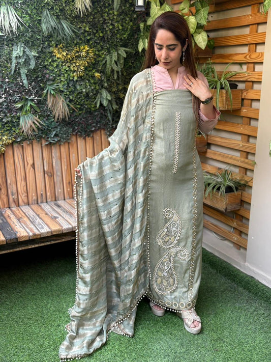 Unstitched suit crafted in rich tissue shimmer fabric