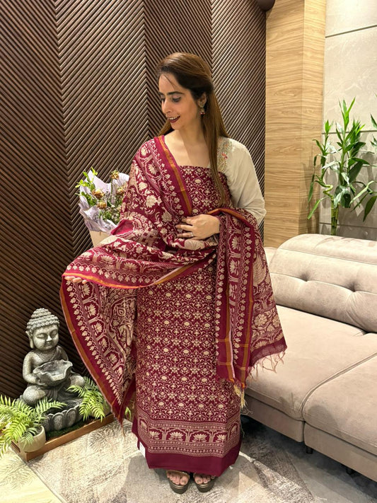 Designed unstitched suit featuring elegant traditional prints.