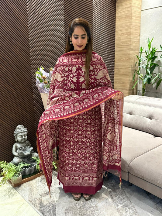 Designed unstitched suit featuring elegant traditional prints.