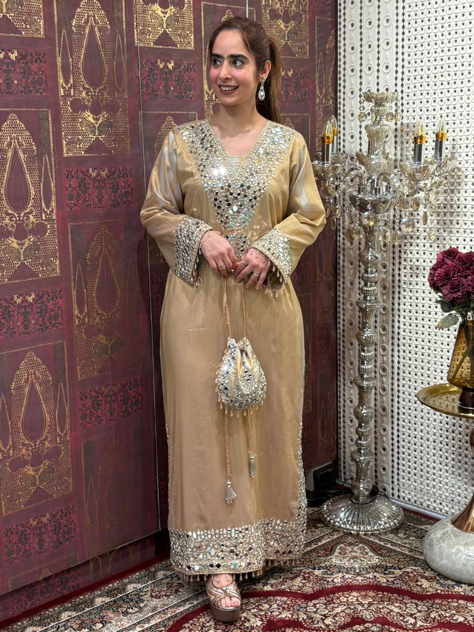 Elegant long kurta set is crafted in luxurious tissue silk fabric