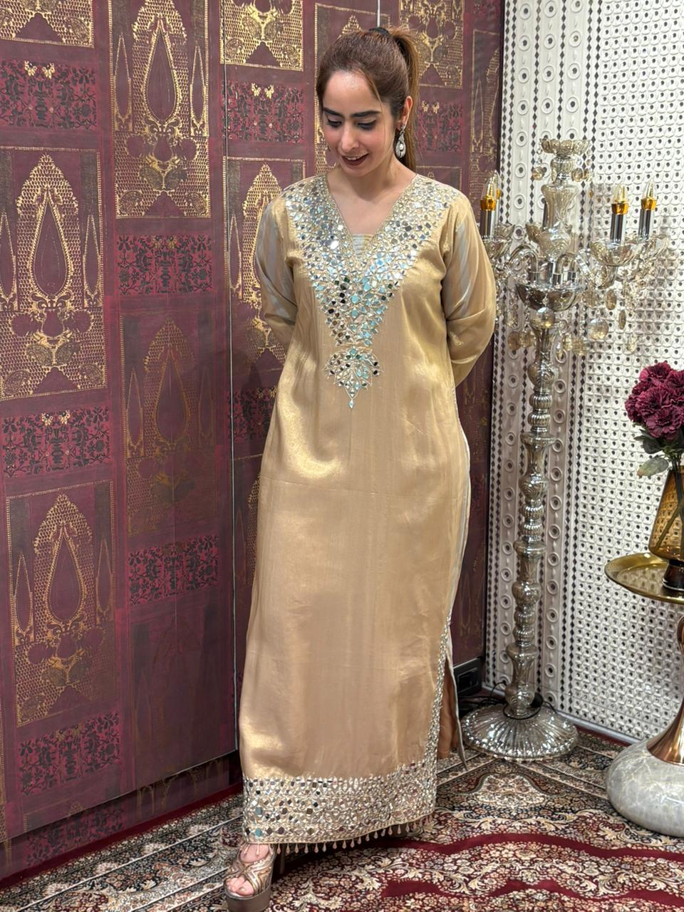 Elegant long kurta set is crafted in luxurious tissue silk fabric