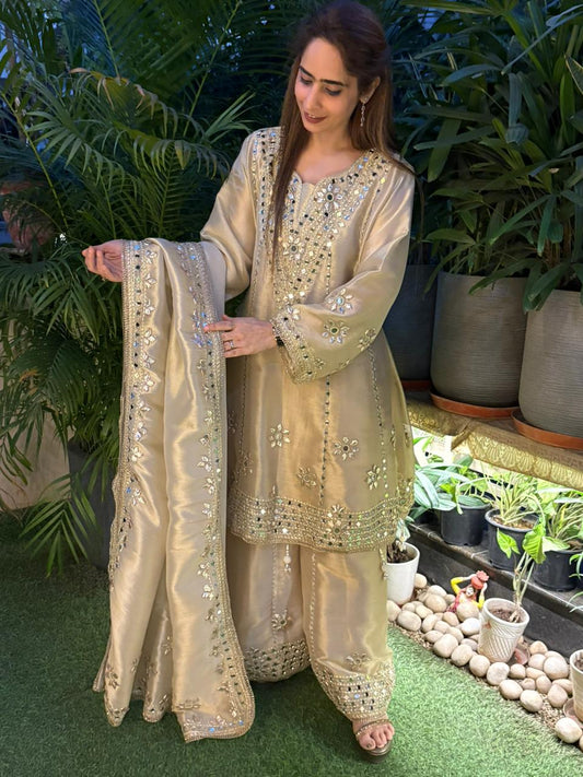 Exquisite Anarkali set is crafted in luxurious tissue silk fabric